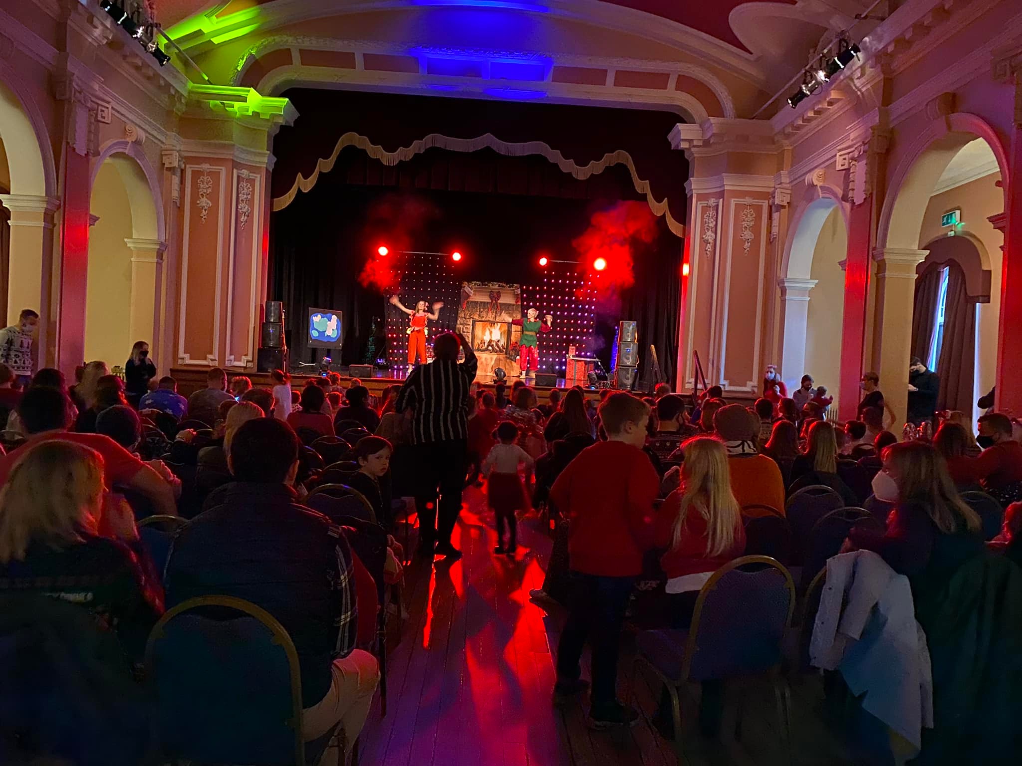 A packed hall dancing along with the show